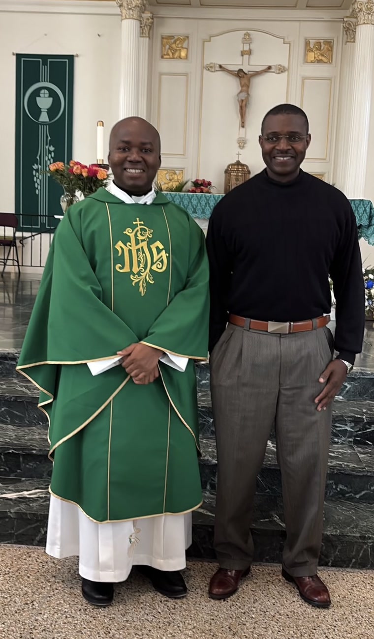 Docteur Kerold with a priest in the sanctuary after Mass